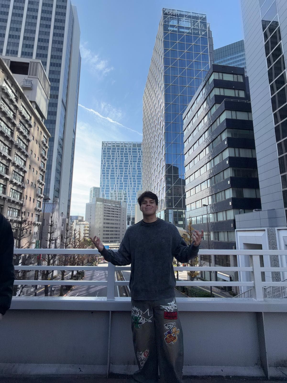 Andrew on a city bridge